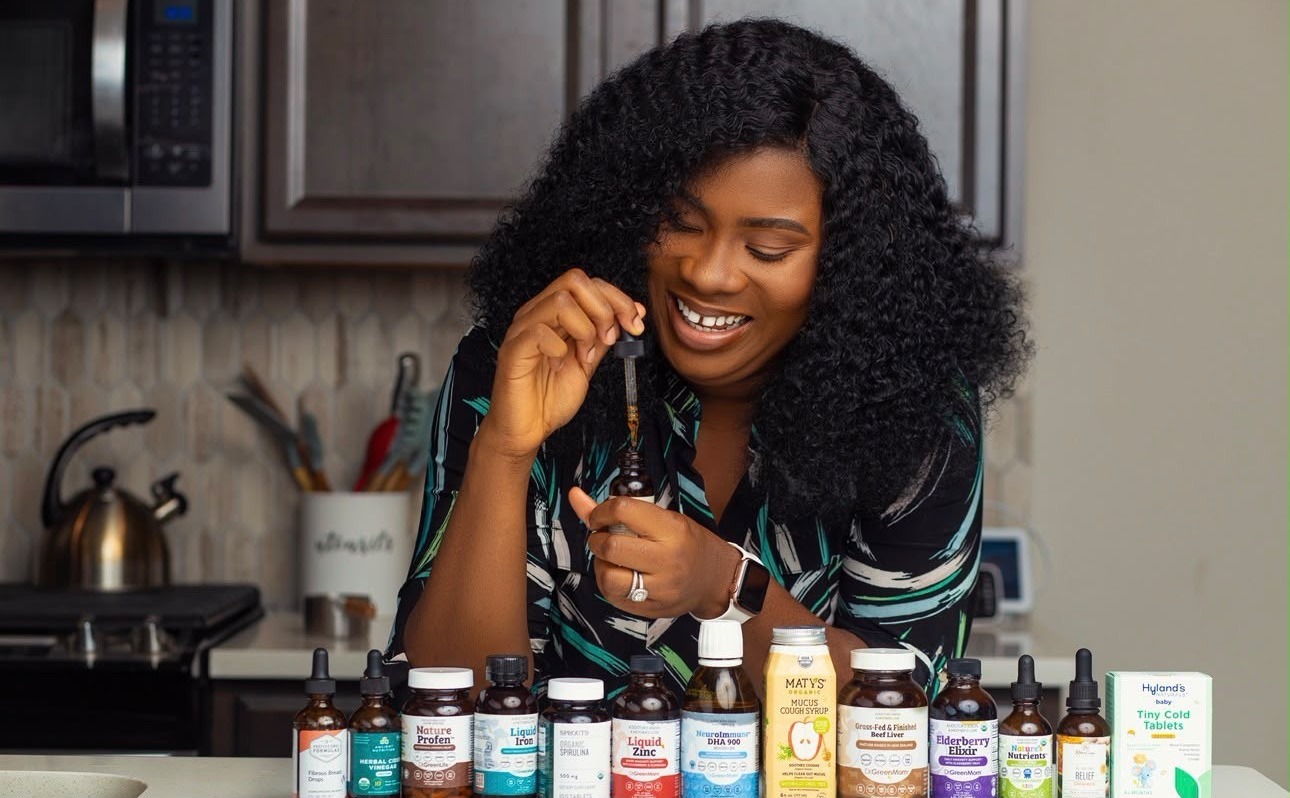 Dr. Amara Yoro preparing natural supplements